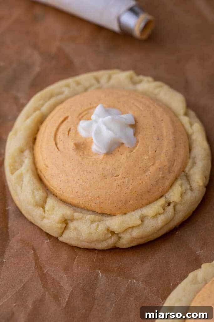 Pumpkin Pie Perfection Crumbl Style 11 Close up of Crumbl pumpkin pie cookies on a plate