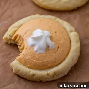 Pumpkin Pie Perfection Crumbl Style 12 Crumbl pumpkin pie cookie with a bite taken out of it