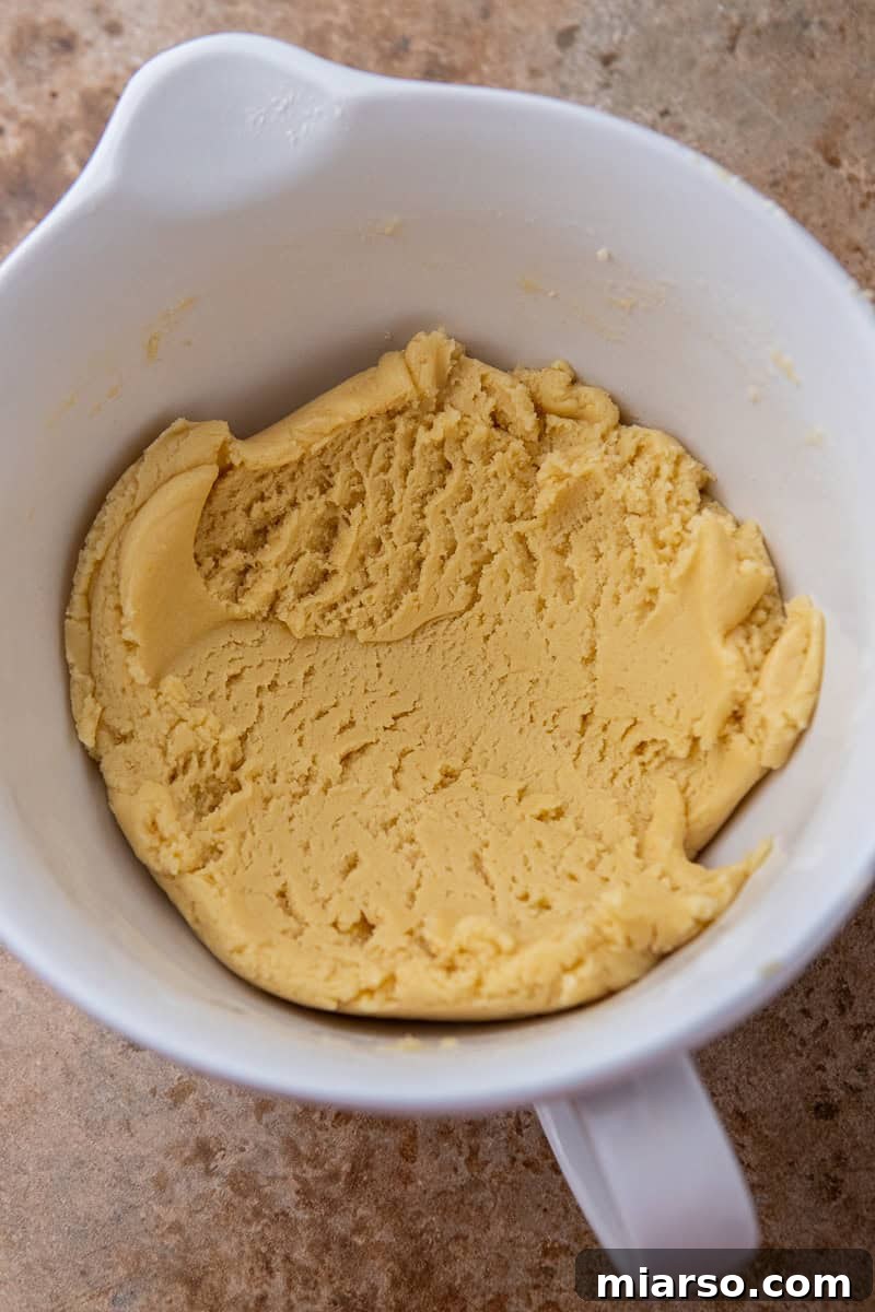 Pumpkin Pie Perfection Crumbl Style 5 Cookie dough being prepared for Crumbl pumpkin pie cookies