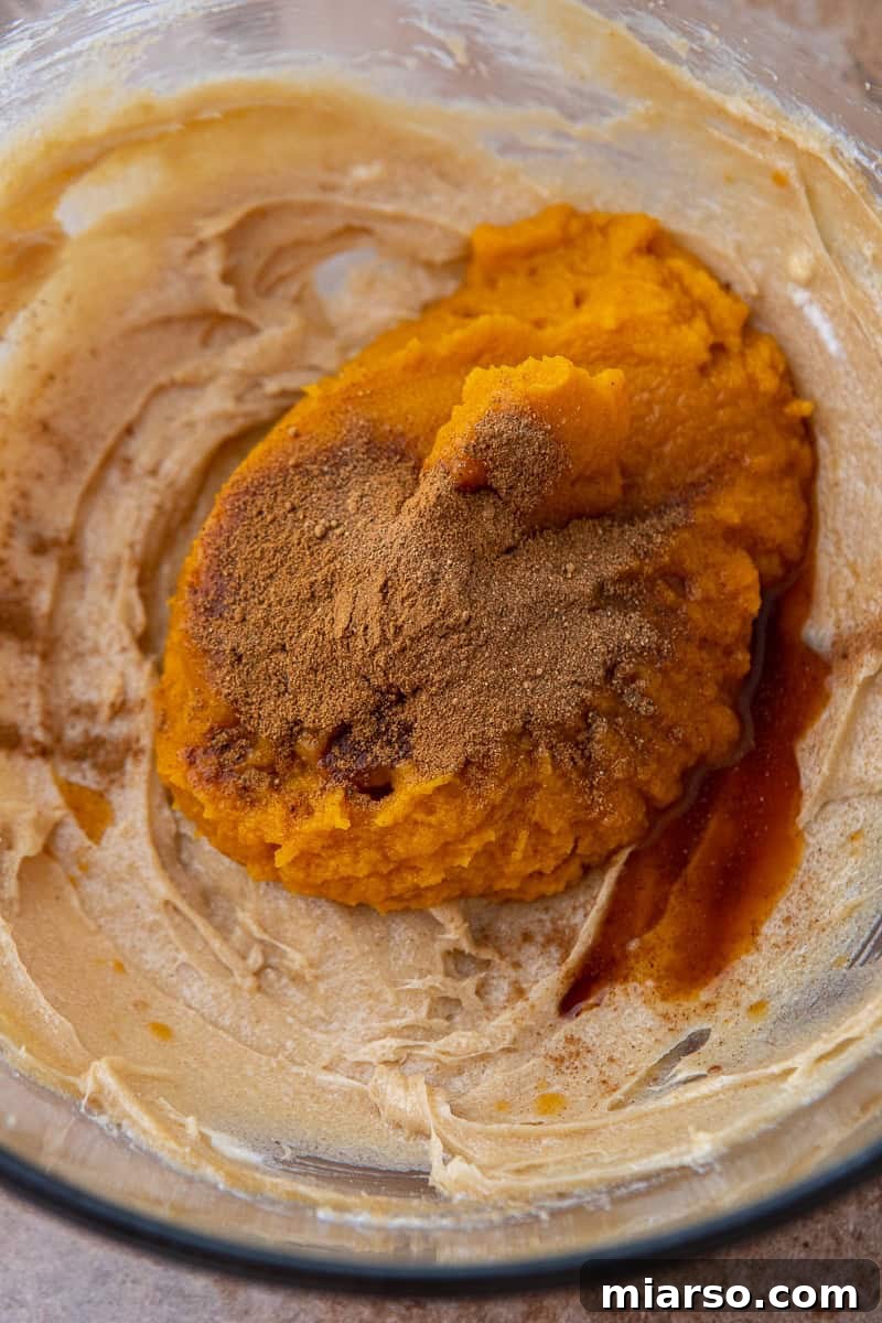 Pumpkin Pie Perfection Crumbl Style 7 Mixing wet ingredients for Crumbl pumpkin pie cookies