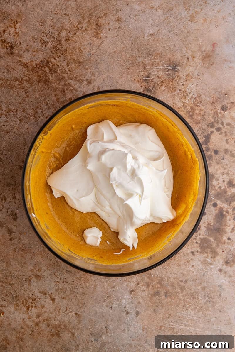 Pumpkin Pie Perfection Crumbl Style 8 Combining dry and wet ingredients for Crumbl pumpkin pie cookies