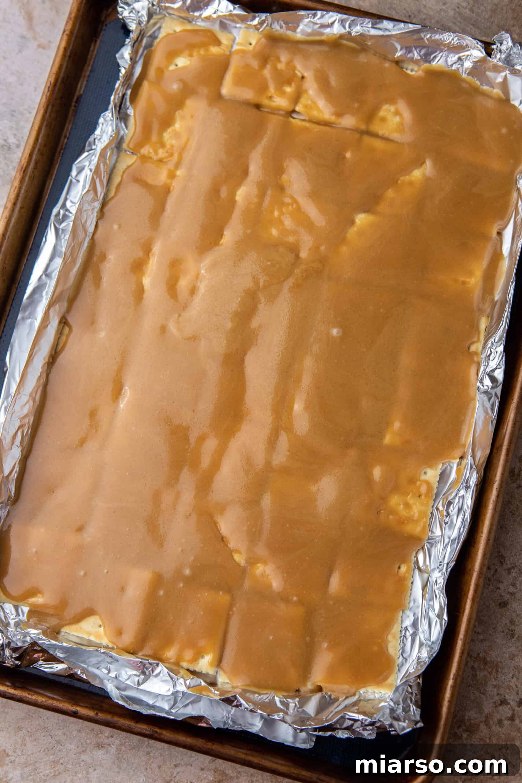 Toffee mixture on saltines