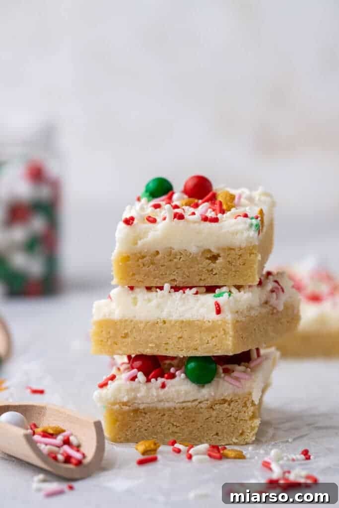 Stack of Christmas sugar cookies bars with colorful sprinkles