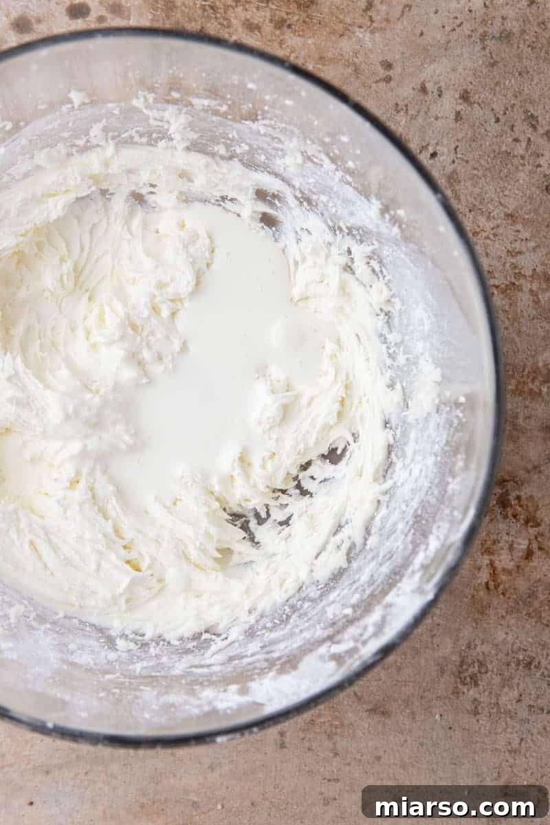 Smooth vanilla buttercream in a mixing bowl