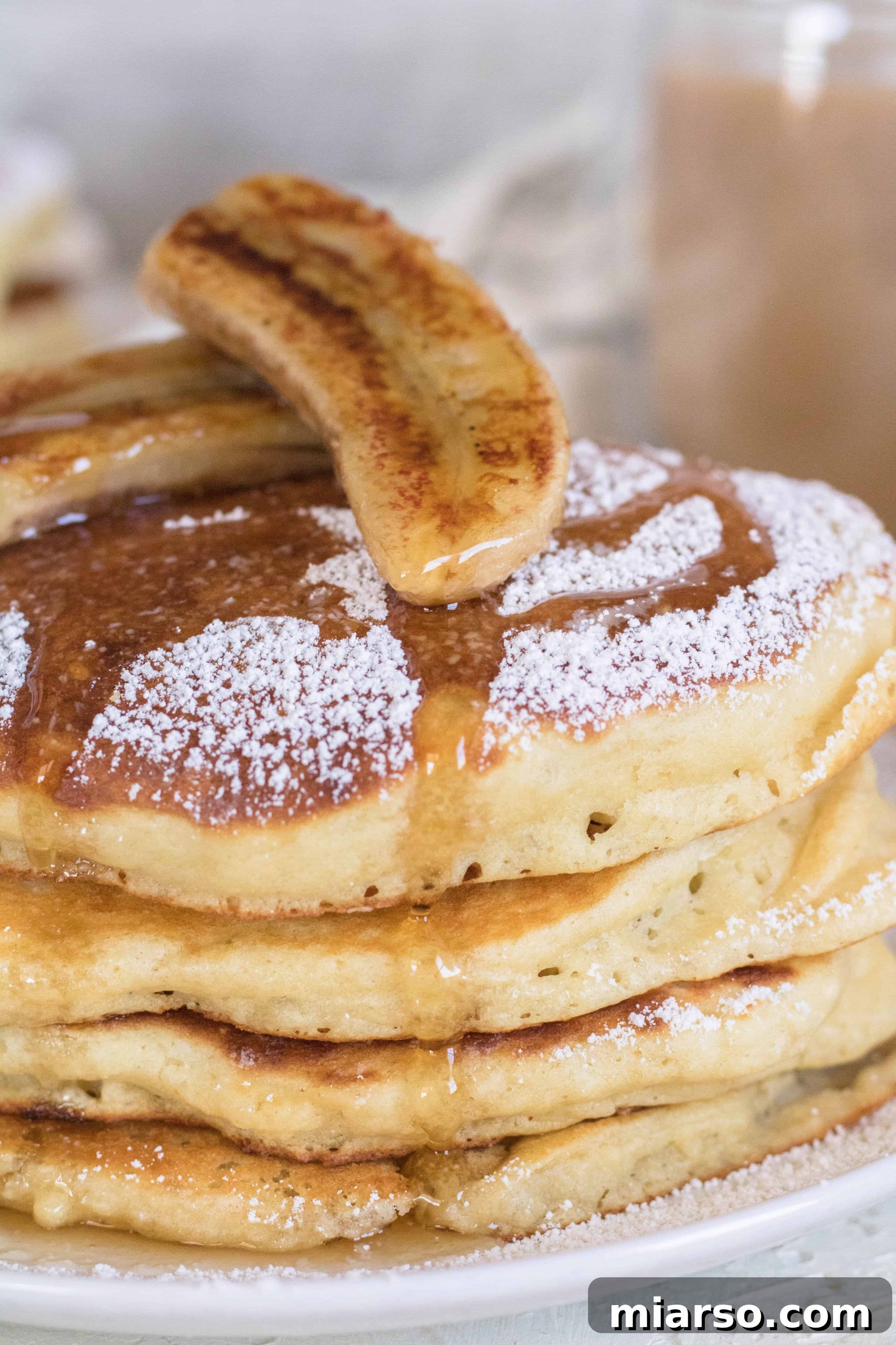 Stack of boxed pancake mix with banana on top