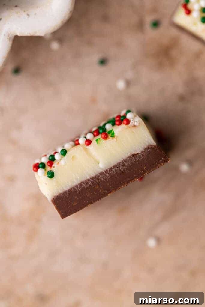 Holiday Showstopper Layered Fudge 3 Close up shot of layered Christmas fudge with sprinkles