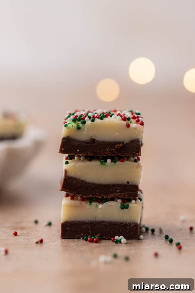 Holiday Showstopper Layered Fudge 10 Stack of Christmas fudge squares with sprinkles