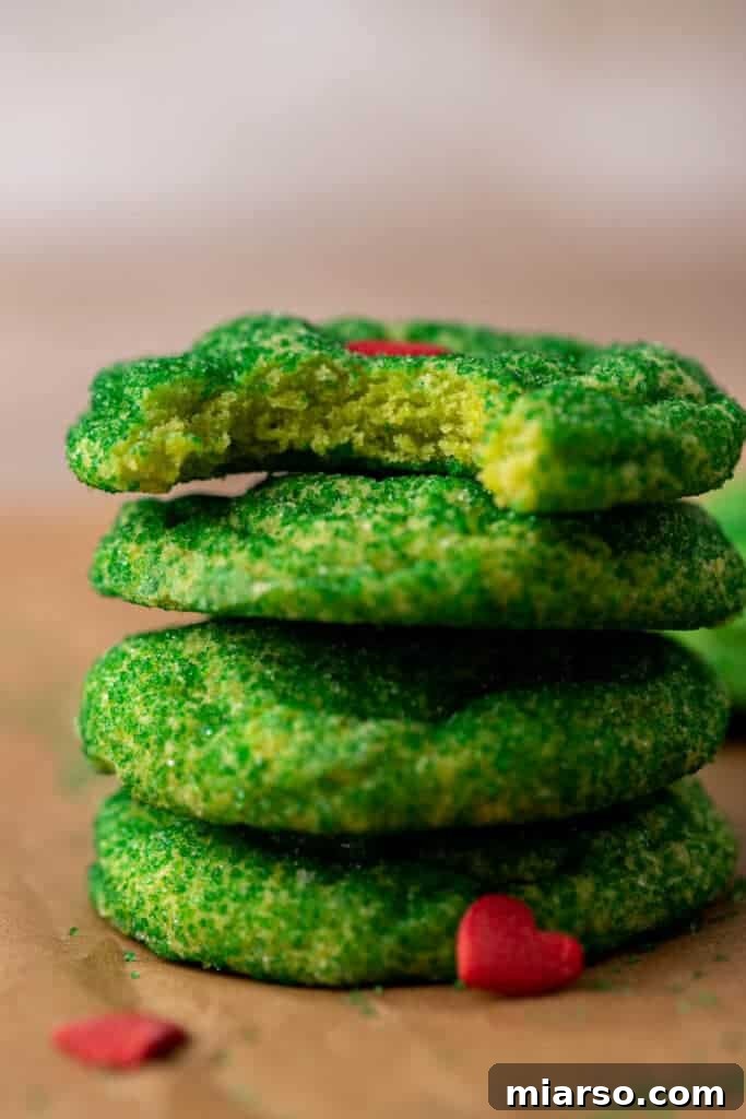 Grinch's Heart-Melting Sugar Cookies 3 Close-up of baked Grinch sugar cookies on a cooling rack, showcasing their soft texture