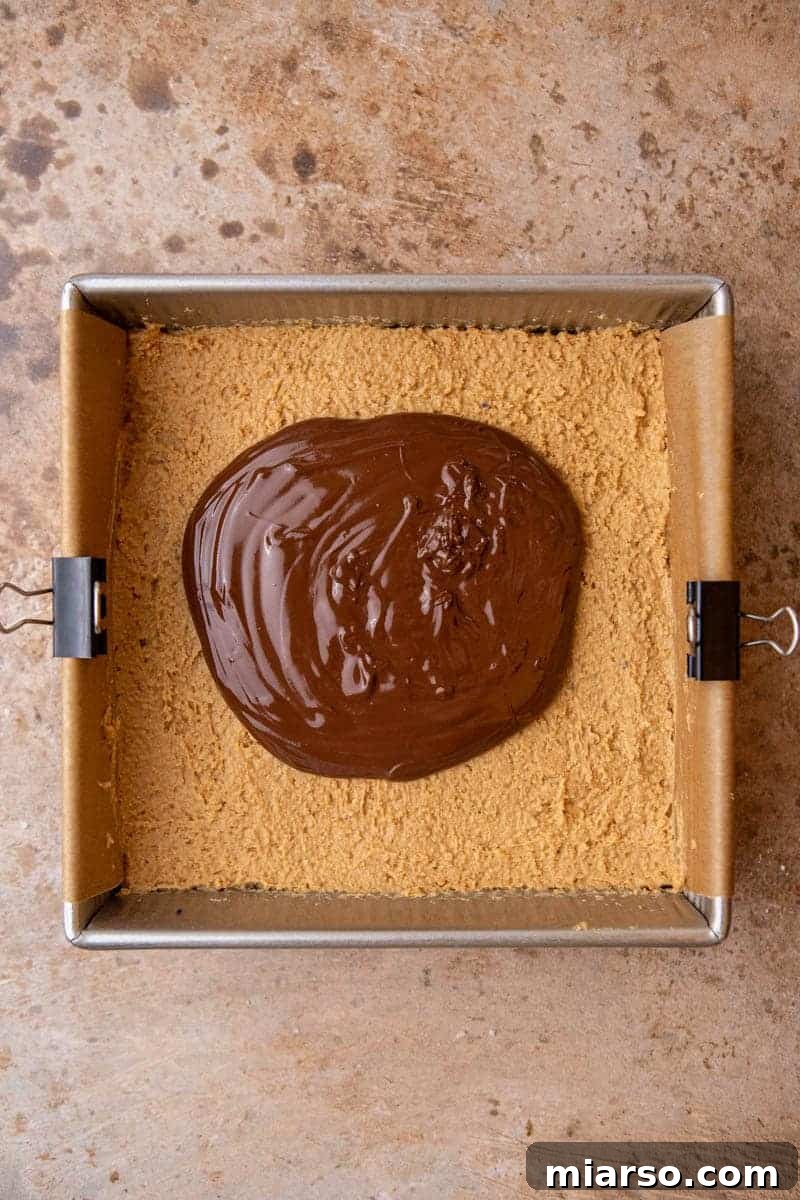 No-Bake Peanut Butter Oreo Bars 9 Melted chocolate on top of peanut butter bars
