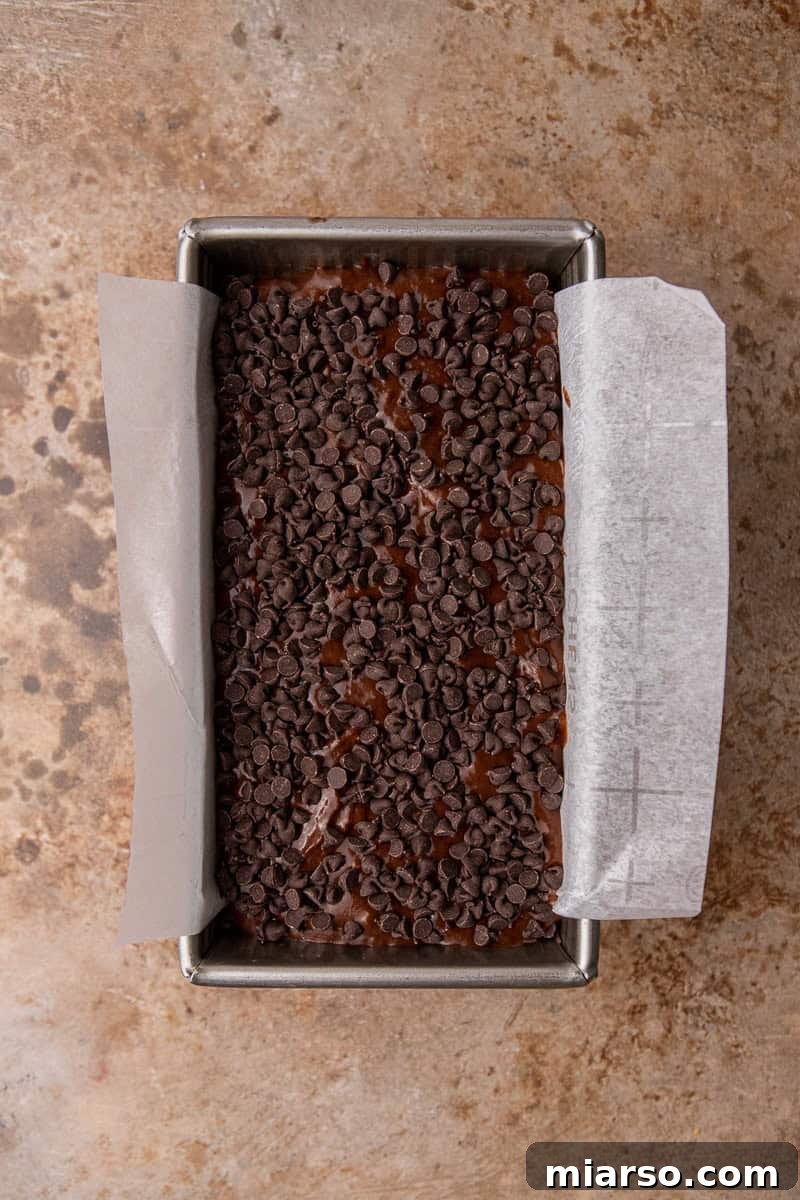 Decadent Double Chocolate Banana Bread 7 Chocolate banana bread batter in a pan