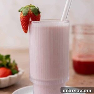 Homemade Strawberry Milk Made Easy 11 strawberry milk in a ribbed glass