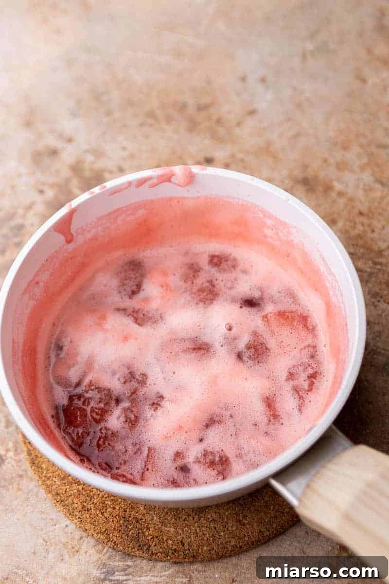 Homemade Strawberry Milk Made Easy 5 strawberry syrup in a pot
