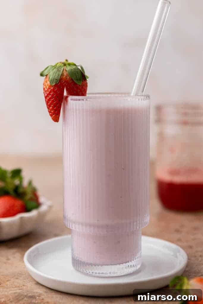 Homemade Strawberry Milk Made Easy 9 strawberry milk in a ribbed glass