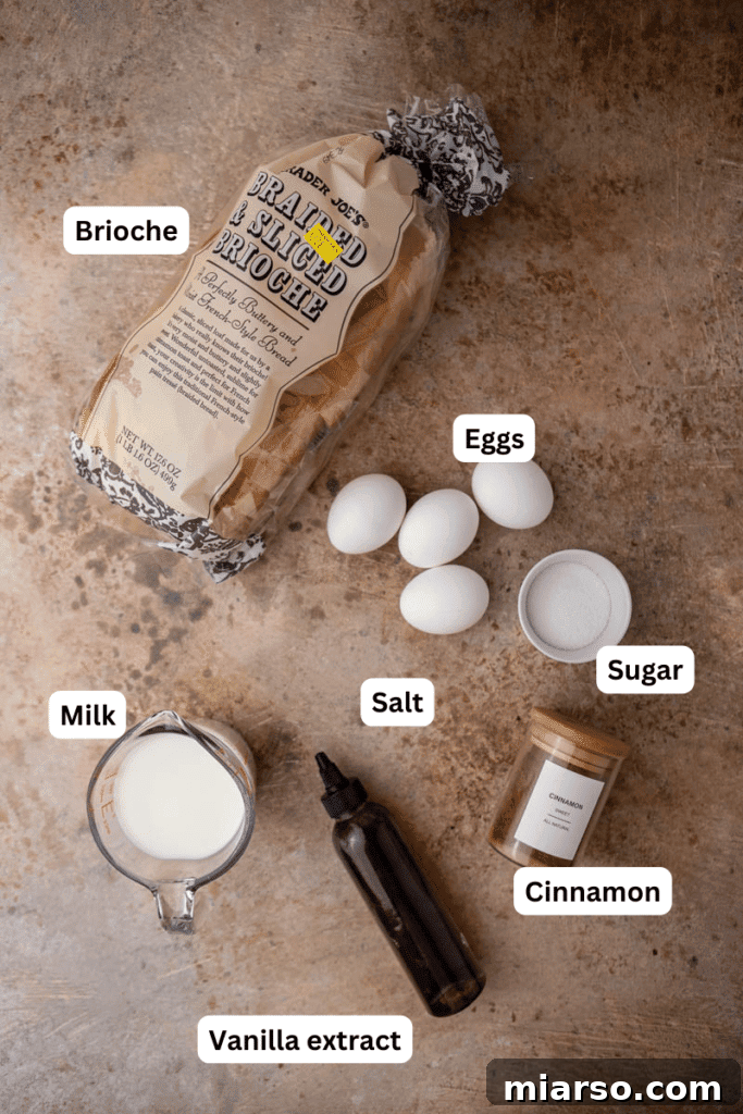 The Ultimate Brioche French Toast 3 A collection of fresh ingredients including brioche bread, eggs, milk, and vanilla extract on a kitchen counter, ready for French toast preparation