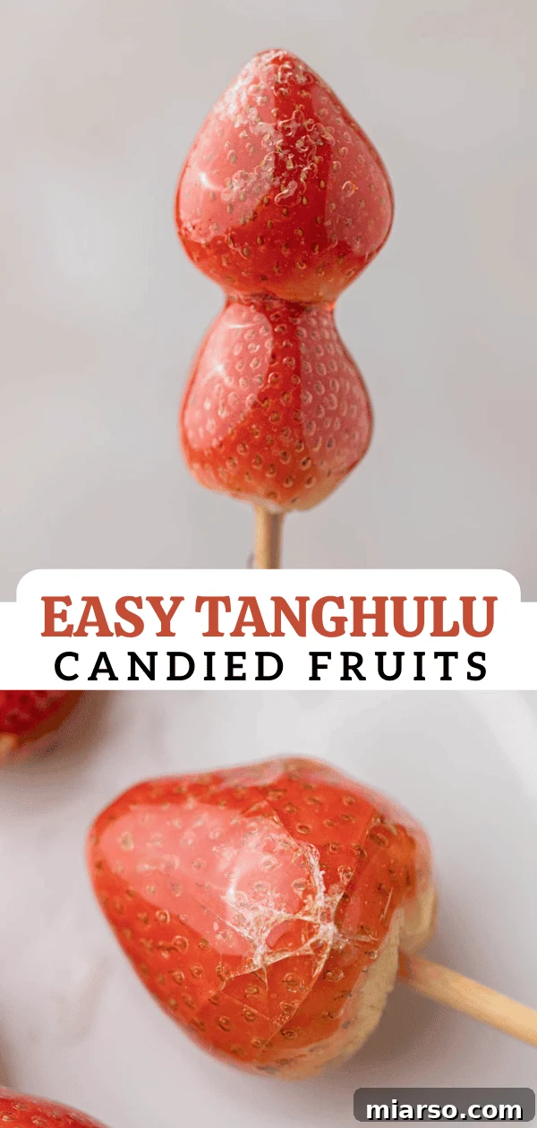 Tanghulu recipe, a close-up shot of perfectly coated strawberries on skewers.