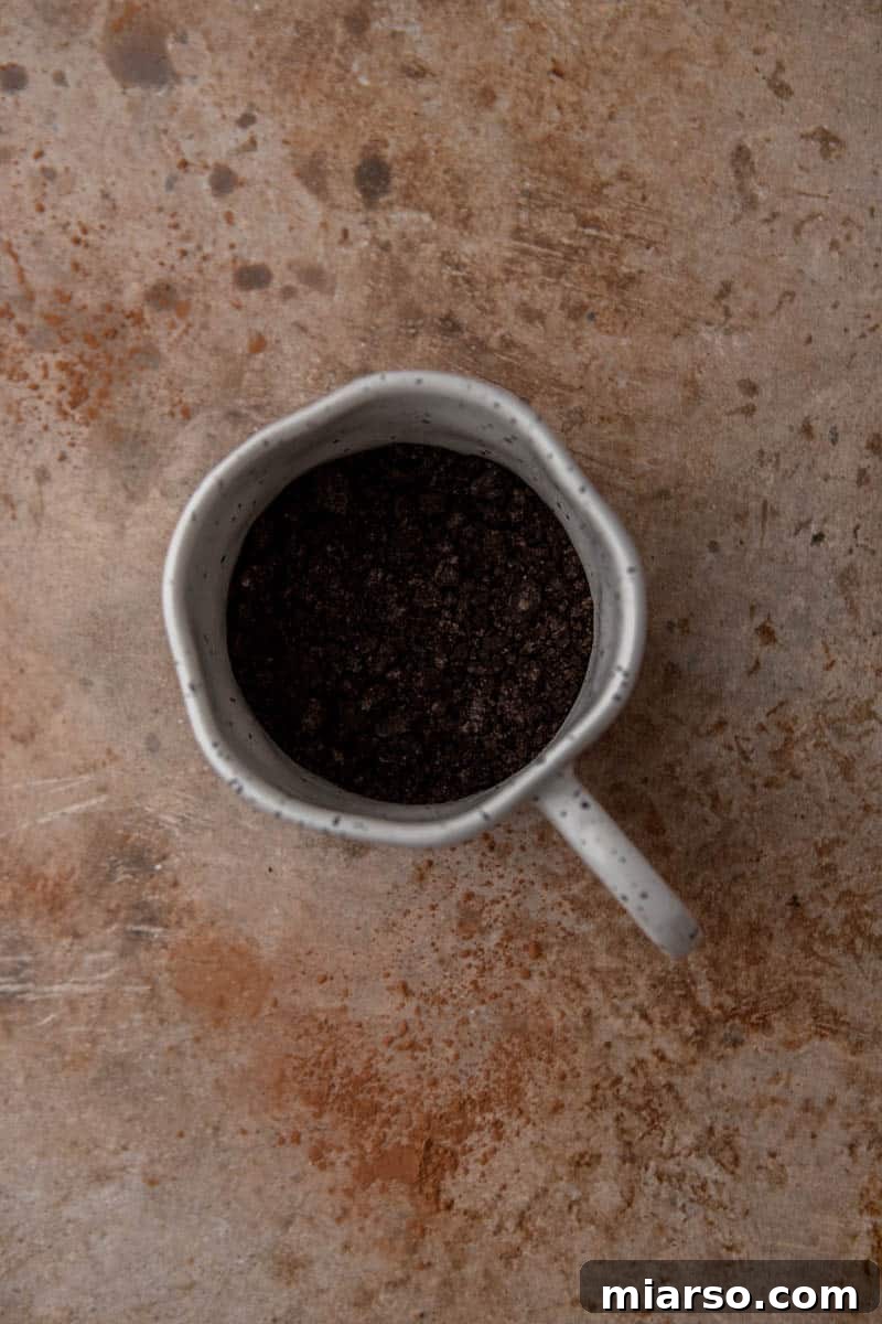 TikTok Oreo Lava Mug Cake 4 Oreo crumbs in a mug