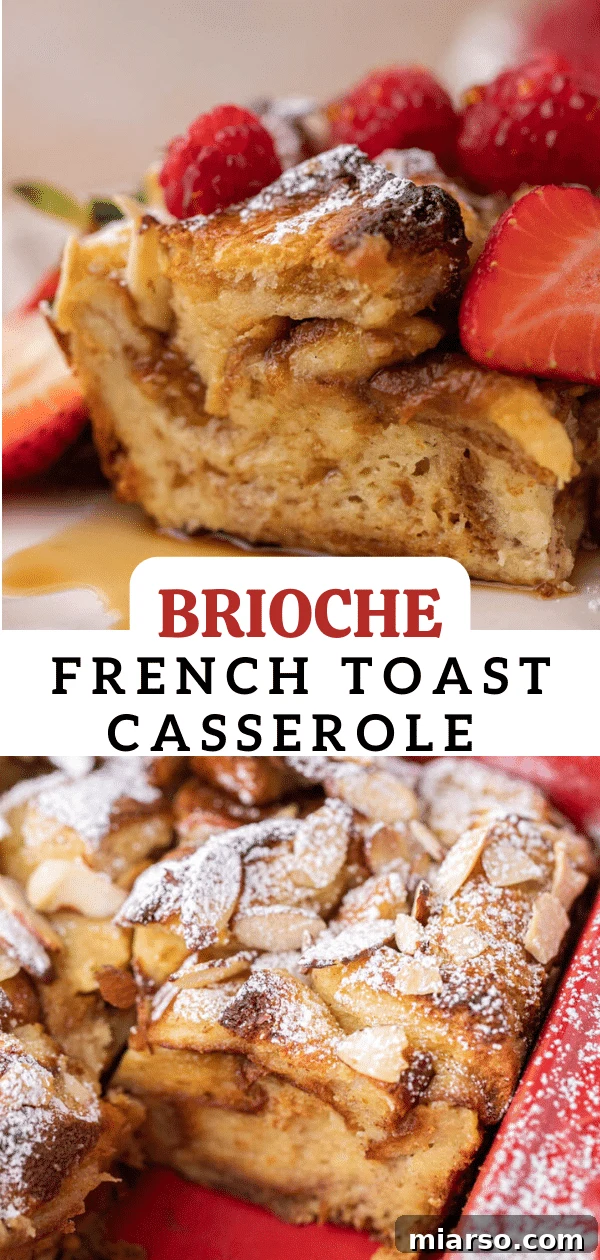 Close-up of baked brioche french toast casserole, garnished with powdered sugar and berries.