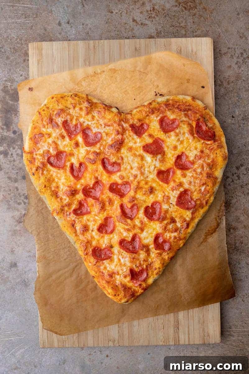 Perfectly baked Heart-shaped pizza, ready to serve for Valentine's day 