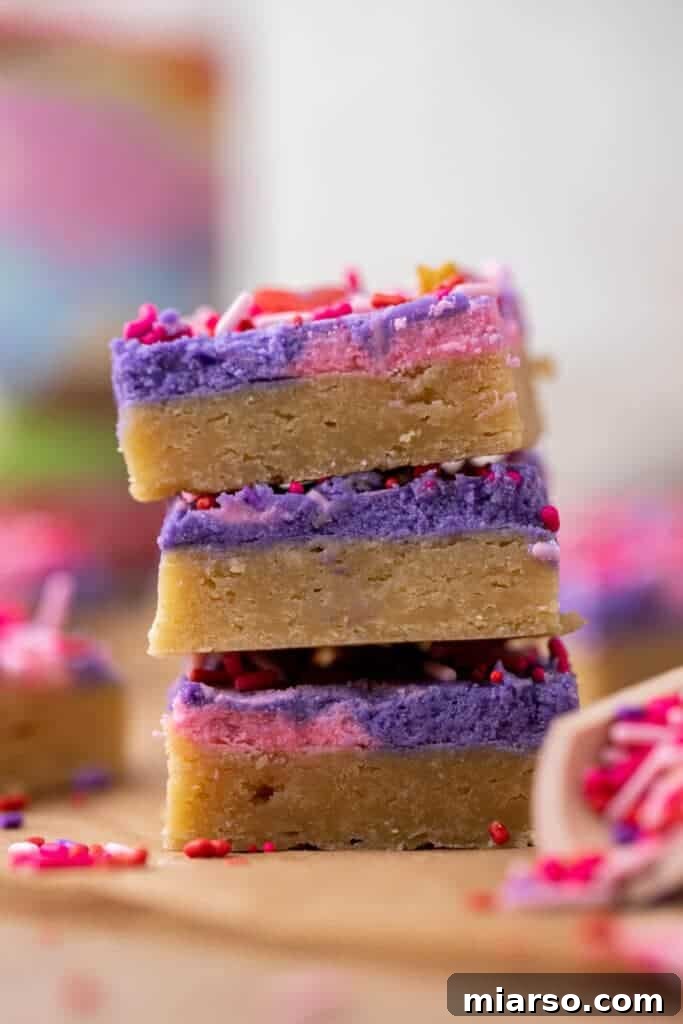 Sweetheart Sugar Cookie Bars 2 Stack of Valentine's day cookie bars with pink frosting and sprinkles