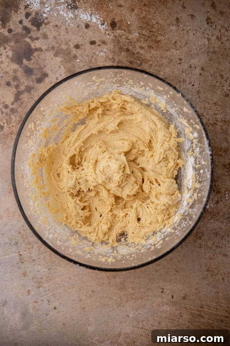 Sweetheart Sugar Cookie Bars 6 Cookie dough in a mixing bowl