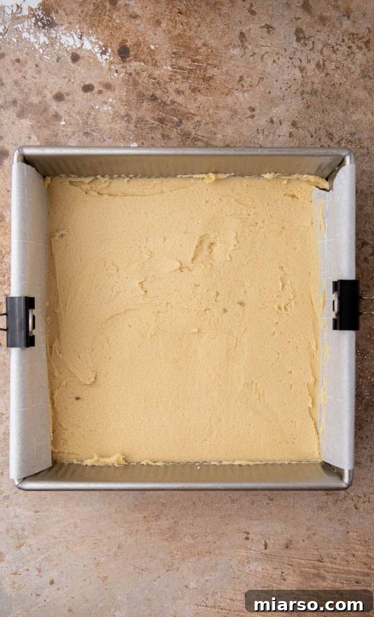 Sweetheart Sugar Cookie Bars 7 Cookie dough spread on a baking pan