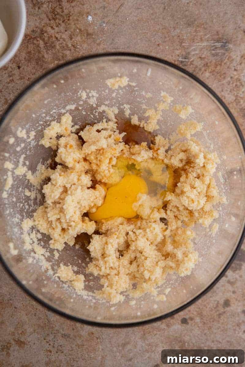 Luscious Lemon Crumbl Cheesecake Cookies 4 Creamed butter and egg mixture in a mixing bowl