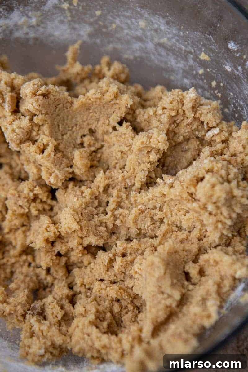 Luscious Lemon Crumbl Cheesecake Cookies 6 Cookie dough mixture in a bowl