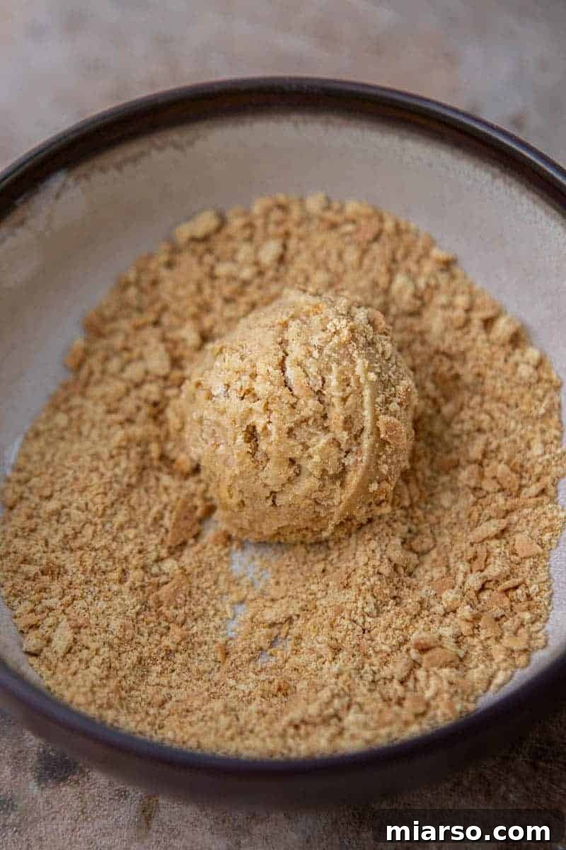 Luscious Lemon Crumbl Cheesecake Cookies 7 Scooped cookie dough ball ready for baking