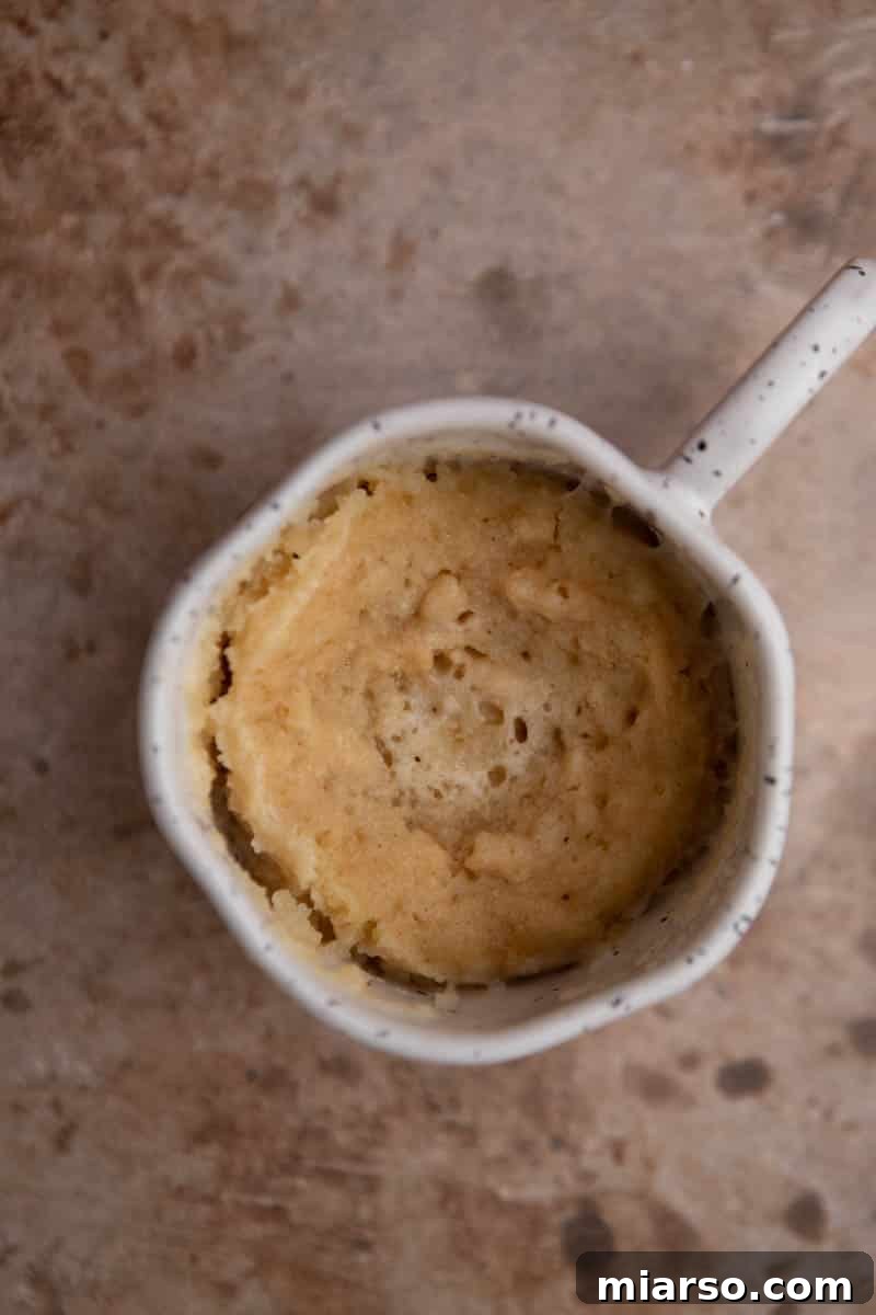 Molten Gold Oreo Mug Cake: Just 3 Ingredients 6 A freshly microwaved molten Golden Oreo mug cake, showing the top surface.