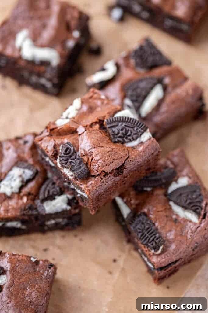 Decadent Oreo Fudge Brownies 11 A perfectly sliced fudgy Oreo brownie, revealing the dense chocolate interior and chunks of Oreo cookies.