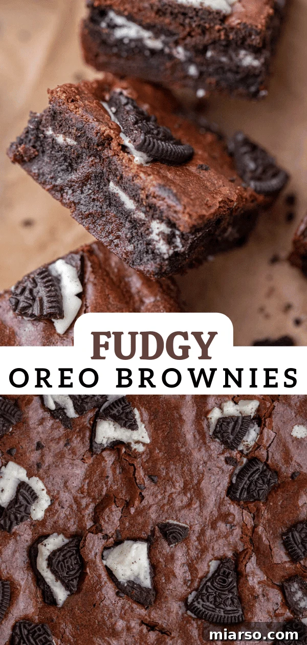 Decadent Oreo Fudge Brownies 17 A stack of three perfectly baked fudgy Oreo brownies, showcasing their rich texture and layers.