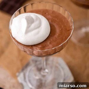 Mousse au chocolat with whipped cream and chocolate shavings