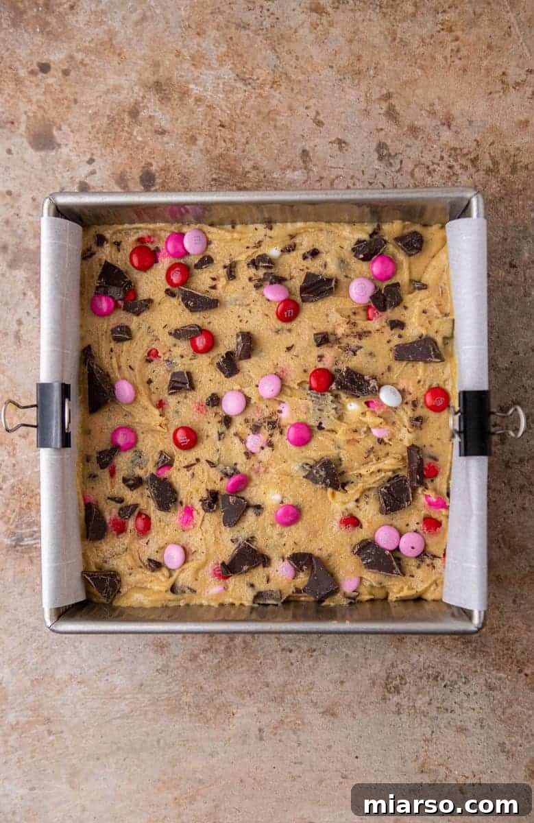 Blondies baking evenly in a pan, edges turning golden
