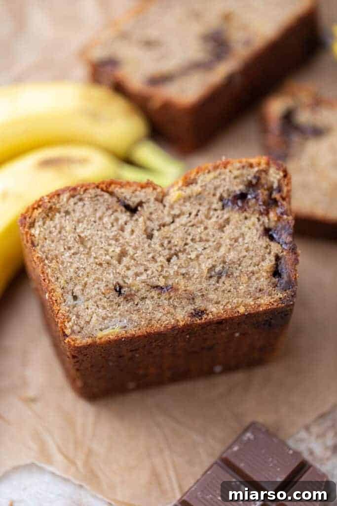 A half-eaten loaf of moist eggless banana bread