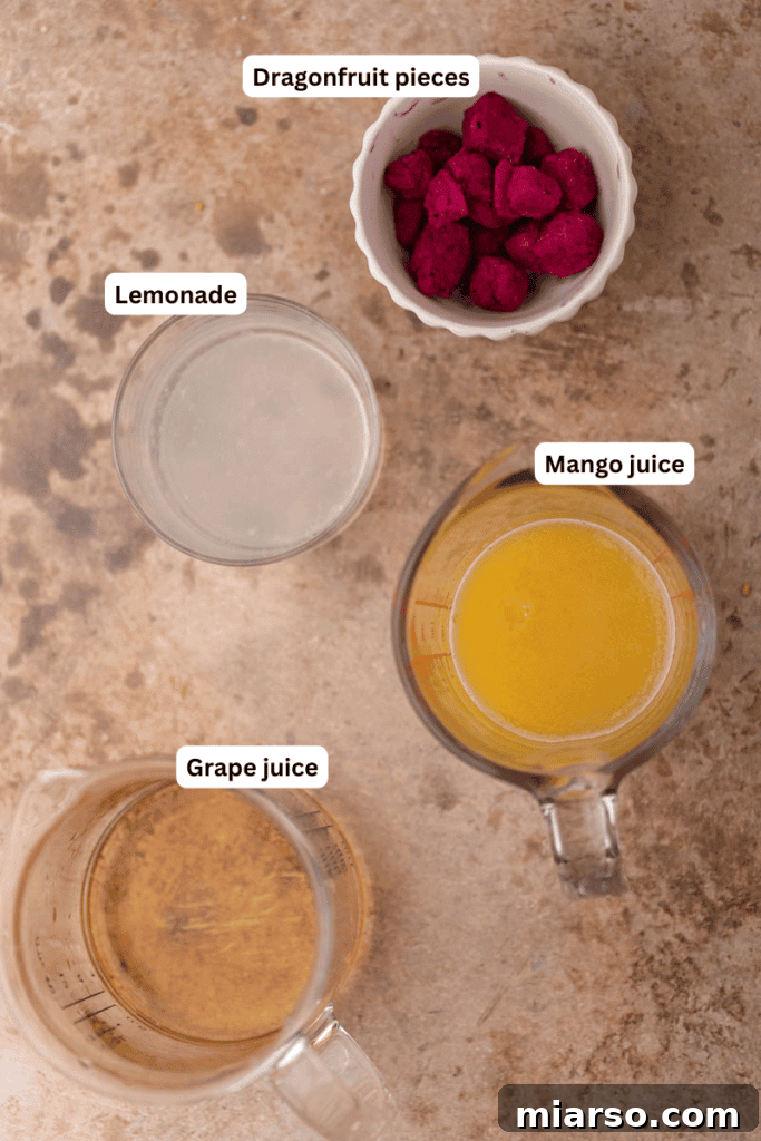 Variety of ingredients laid out on a kitchen counter for the mango dragonfruit refresher recipe