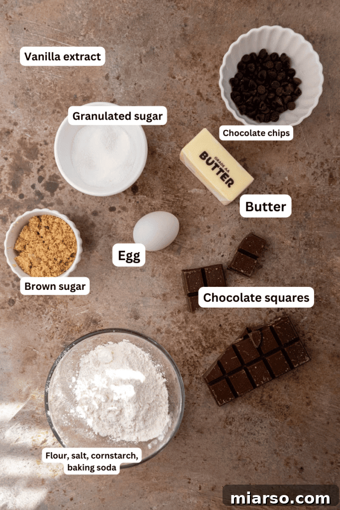 Ingredients for chocolate stuffed chocolate chip cookies laid out on a kitchen counter