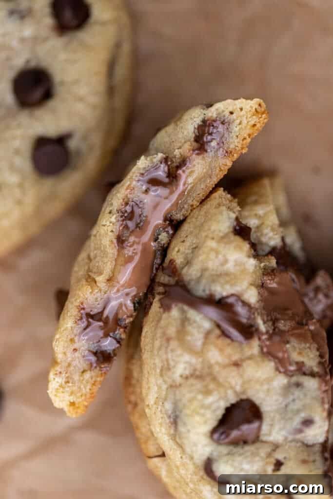 Close-up of stuffed chocolate chocolate chip cookies on a baking sheet
