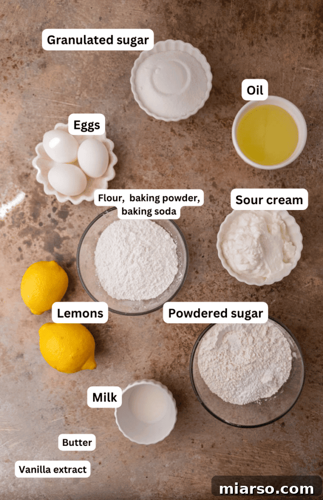 Various baking ingredients laid out on a kitchen counter, including lemons, eggs, and flour.