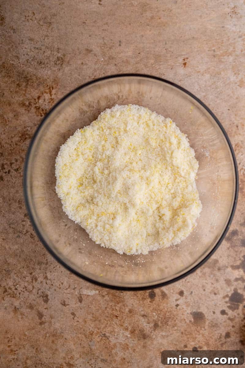 Close-up of lemon-infused sugar in a bowl.