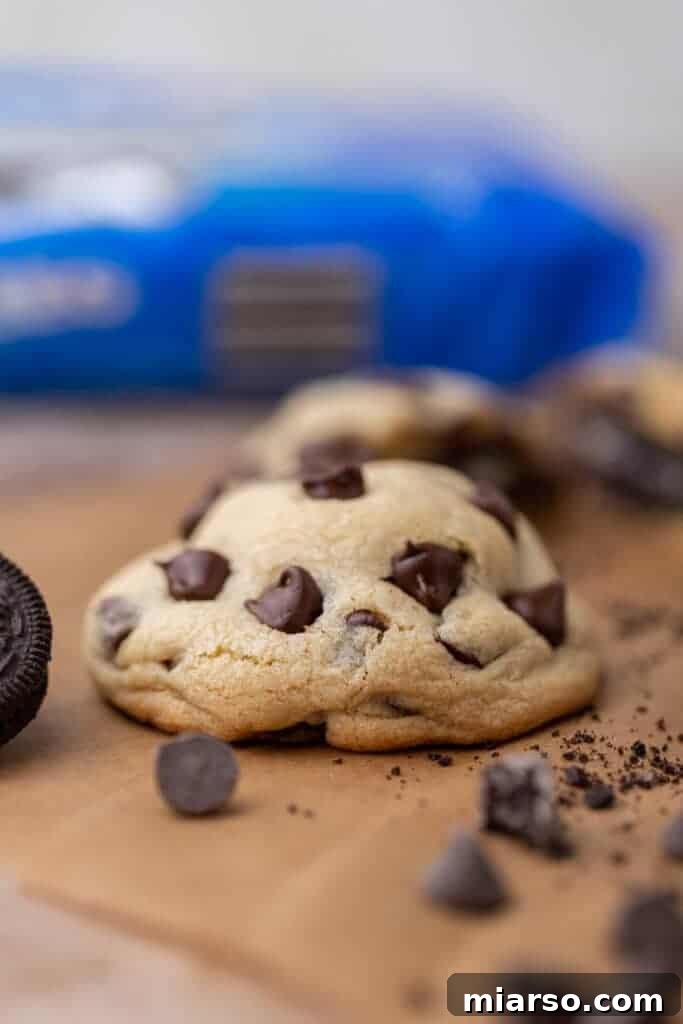 Oreo Stuffed Chocolate Chip Cookies Made Simple 3 A stack of perfectly baked, thick Oreo stuffed chocolate chip cookies, ready to be enjoyed.