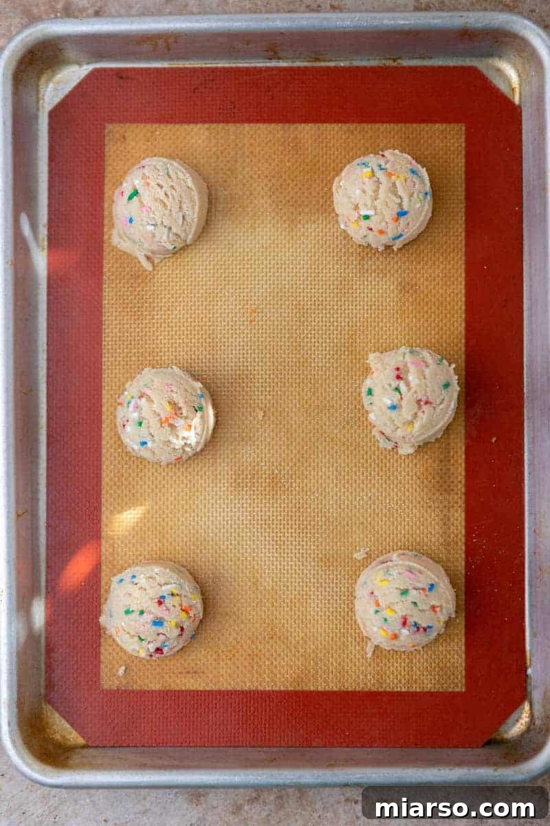 Irresistible Sprinkle Sugar Cookies 8 Sprinkle cookie dough balls on baking sheet
