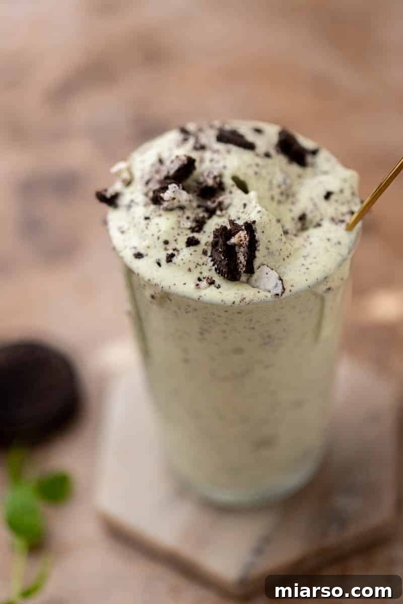 DIY McDonalds Shamrock Oreo McFlurry 7 Oreo Shamrock Mcflurry poured into a glass, garnished with extra crushed Oreos