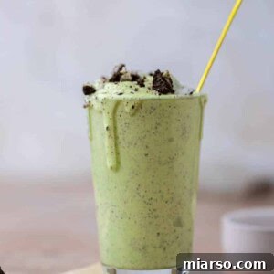 DIY McDonalds Shamrock Oreo McFlurry 9 McDonald's Shamrock Oreo McFlurry in a glass with a spoon