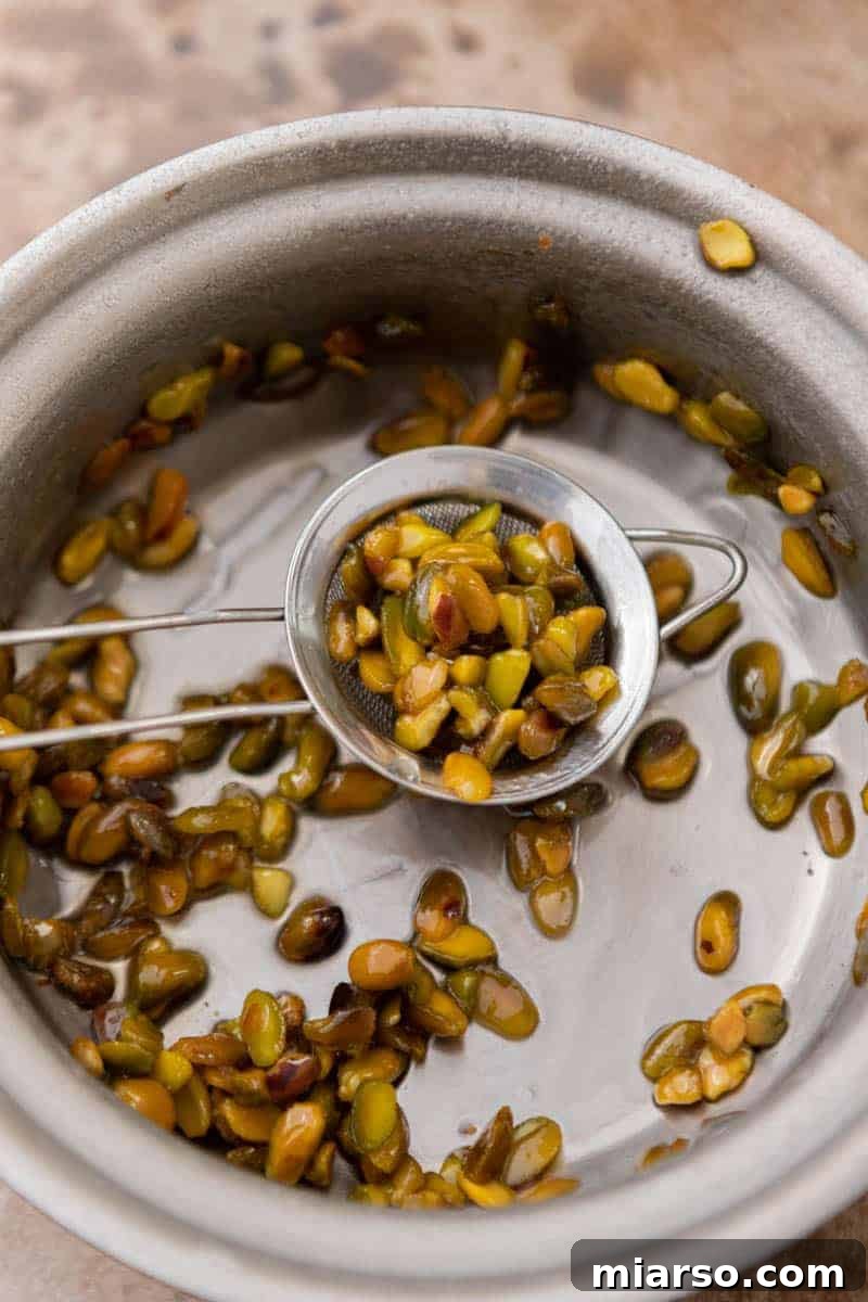 Starbucks Pistachio Syrup: Your Coffee's Delicious Upgrade 6 Pistachios, sugar, and water boiling in a pot, creating the syrup base