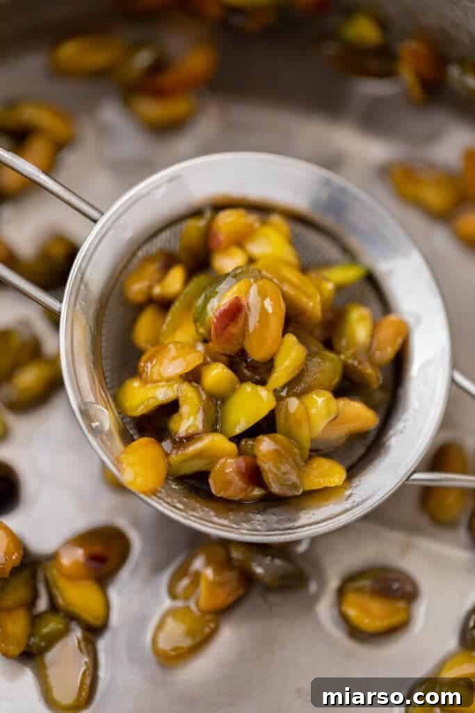 Starbucks Pistachio Syrup: Your Coffee's Delicious Upgrade 8 Leftover pistachios collected in a fine-mesh sieve after straining the syrup