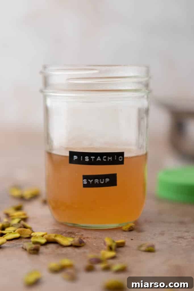 Starbucks Pistachio Syrup: Your Coffee's Delicious Upgrade 9 Starbucks-style pistachio syrup in a clear glass jar, with a label and ready for use