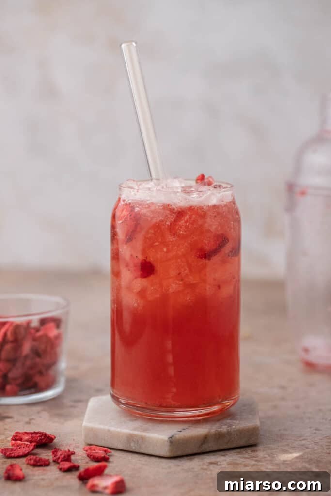 Craft Your Own Starbucks Strawberry Acai Refresher 2 Starbucks strawberry acai refresher in a glass with ice