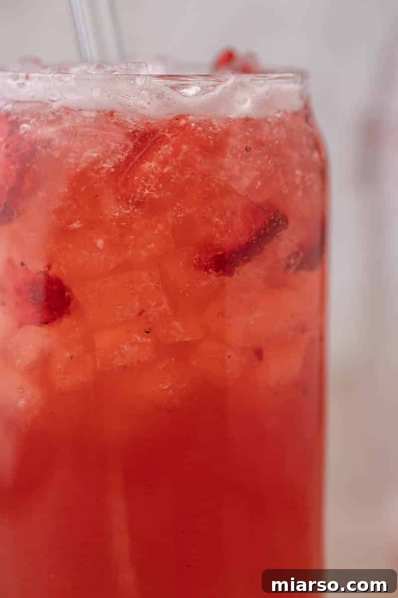 Craft Your Own Starbucks Strawberry Acai Refresher 7 Completed Starbucks strawberry acai refresher served in a glass