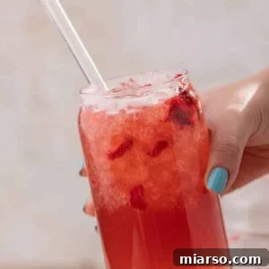Craft Your Own Starbucks Strawberry Acai Refresher 10 Hand holding Starbucks strawberry acai refresher