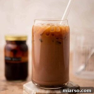 A perfectly prepared iced mocha latte in a tall glass, ready for enjoyment.